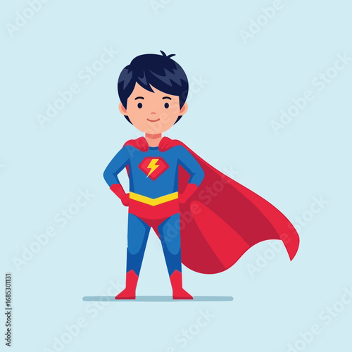 Boy dressed as superhero standing confidently with cape flowing against a light blue backdrop, embodying childhood dreams and heroic aspirations.
