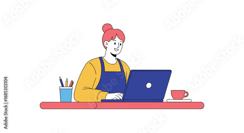 Young woman working productively on her laptop at her desk
