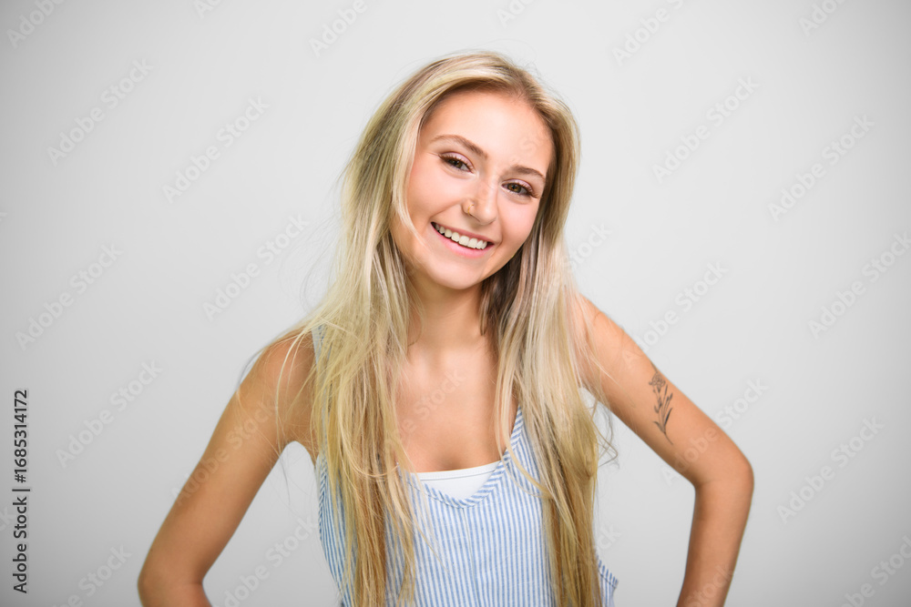 Fototapeta premium Pretty 18 years old blonde girl posing in studio