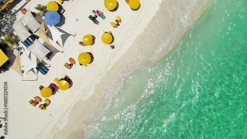 yellow beach umbrellas on the seashore, beach holiday top view