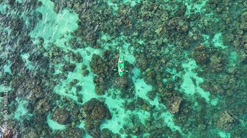 two girls on a kayak in the clear sea