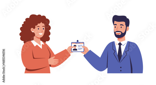 A woman with curly hair hands an identification badge to a bearded man in a professional business suit.
