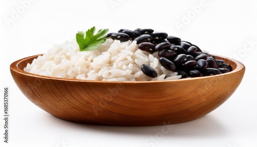 rice and black beans in wooden bowl on white background