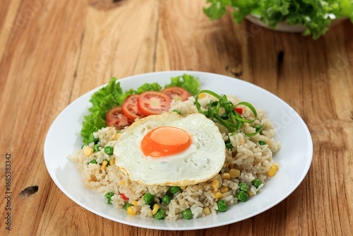 Canvas Print Hong Kong Style Fried Rice or Nasi Goreng Hongkong with Vegetable and Sunny Side Up Egg Topping