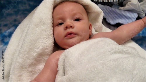 Cute Baby Boy Wrapped in Soft Towel After Bath Time
