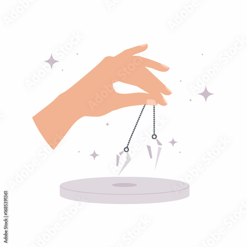 Close up of a woman s hand holding a pendulum over a white pad symbolizing spiritual healing and divination practices