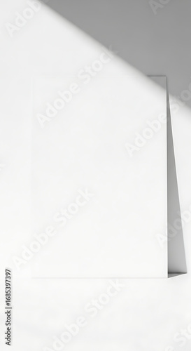 Minimalist Blank White Poster Mockup Against Wall with Diagonal Shadow