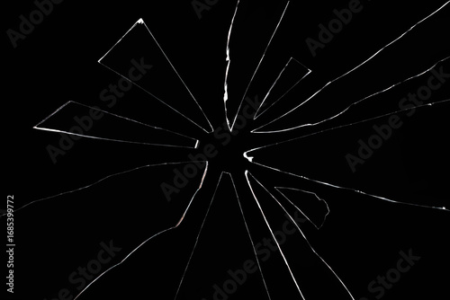 shards of broken glass on black background