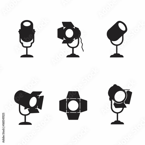 Set of professional stage and studio lighting equipment icons in black silhouette, ideal for entertainment, production, and media design projects.