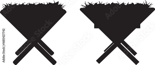 Two identical black silhouettes of nativity mangers with straw on a white background silhouette