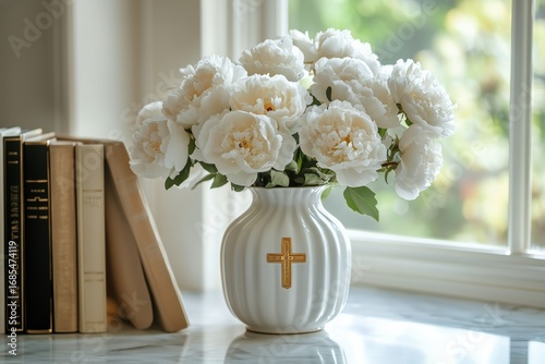 Elegant White Peonies in Vase With Cross Accent on Marble Table.