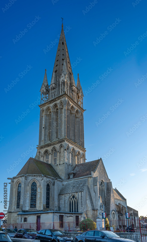 Fototapeta premium Langrune-Sur-Mer, France - 08 09 2025: Panoramic view the facade of the Saint-Martin Church and the cemetery
