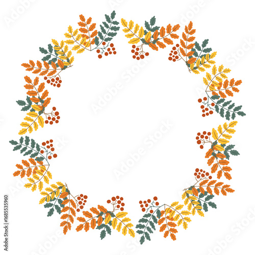 Autumn wreath made of rowan leaves and berries in warm seasonal colors. symbol of fall harvest, natural beauty and festive decoration