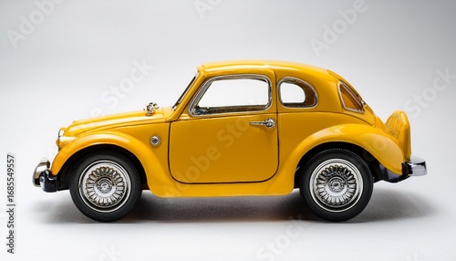a yellow toy car on a white background