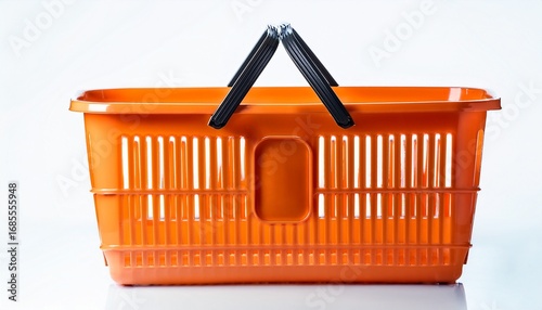 an orange plastic shopping basket with a black handle