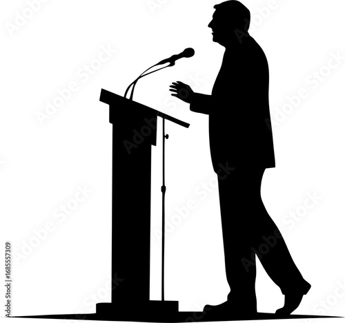 silhouette of a man speaking at podium