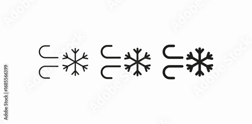 blowing wind snowflake icon sign vector