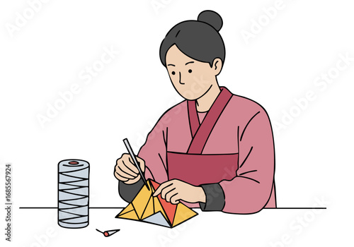 A Japanese woman meticulously crafts a paper kiku (chrysanthemum) using chopsticks.  Detailed, artistic, and focused on traditional craft.  Clean, minimalist composition.