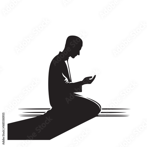 Man performing islamic prayer in a dark silhouette