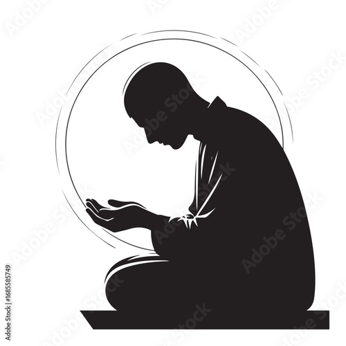 Man performing islamic prayer in a dark silhouette