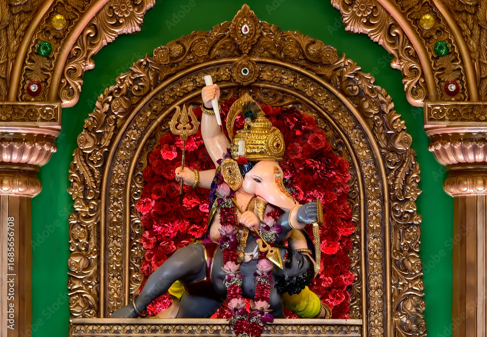Fototapeta premium 27 August 2025, Pune, Maharashtra, India, Beautiful idol of Lord Ganesh installed by Bhausaheb Rangari Ganpati during Ganesh festival 2025.