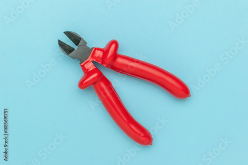 Red Precision Wire Cutters on Blue Background Essential Hand Tool for Electrical Work