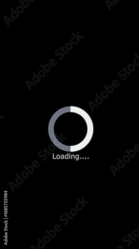 Simple white and grey loading circle animation with text loading on a black background
