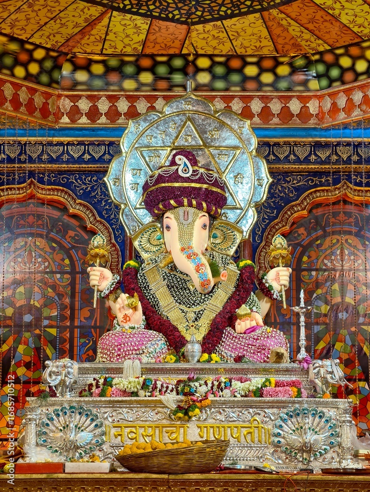 Fototapeta premium 31 August 2025, Pune, Maharashtra, India, Beautiful sculpture of Lord Ganesh called as Hutatma Babu Genu Mandal (pandal) near Mandai location during Ganesh Utsav Festival 2025.