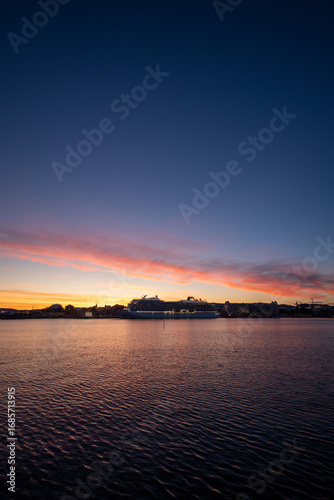 Canvas Print Sunset over a harbor in Oslo