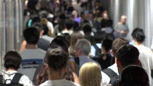 Wallpaper Mural TOKYO, JAPAN - AUG 2025 : Time lapse shot of crowd of people walking at busy downtown area in busy night rush hour. Japanese people, urban city life and lifestyle concept video. Torontodigital.ca