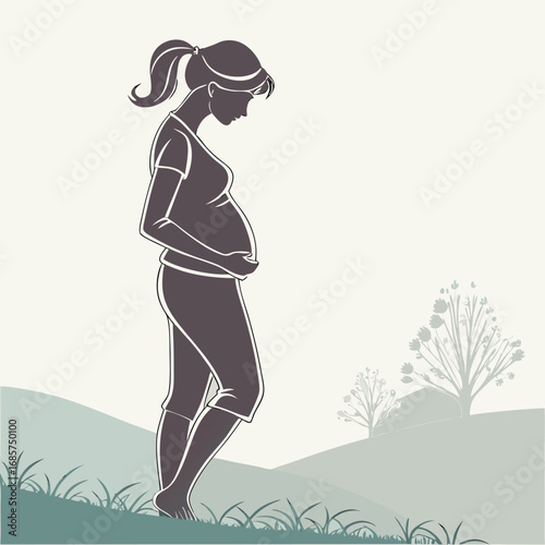 Silhouette of a pregnant woman on a hill landscape