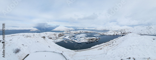 Aerial panoramic view of Unalaska Island in winter, Unalaska, Aleutian Islands. Fishing industry of Dutch Harbor in winter, Alaska