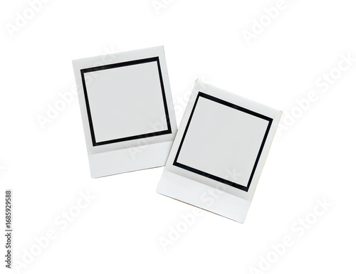 Two blank, square, white photo frames, slightly angled, appear like instant photos