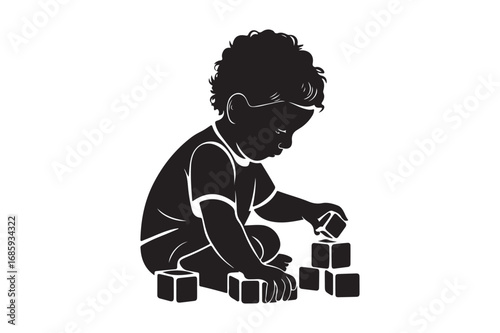 Silhouette of a young child playing with building blocks