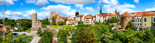 The Panorama captures the charm of an old German town Bautzen with colorful houses, imposing church towers, city fortifications, and a harmonious blend of nature and architecture.