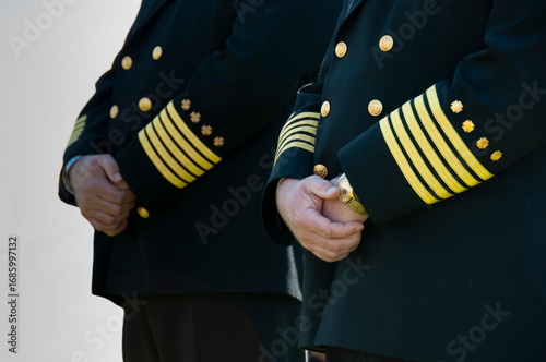 Detail image of police officer dress uniforms at a memorial event.