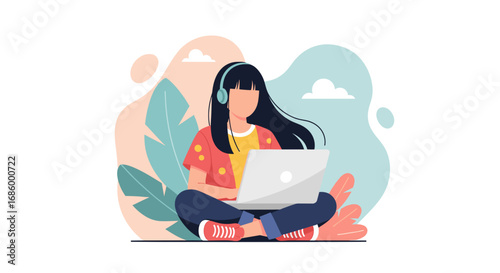 Young woman in headphones sitting cross-legged, focused on her laptop. Ideal for concepts of remote work, online learning, digital nomad lifestyle, productivity, and modern communication.