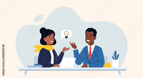 Smiling business professionals collaborate on new ideas at an office desk, representing teamwork, innovation, and successful partnership in a modern work environment.