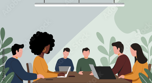A diverse team of professionals collaborates around a modern conference table with laptops in a bright, contemporary office setting.
