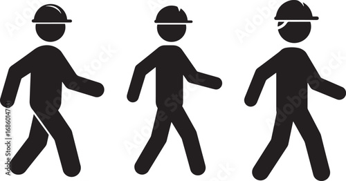 Three construction workers walking in silhouette