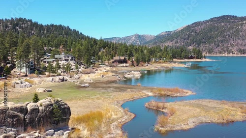 Overview of a Wooden Cabin Along a Stream in Big Bear Lake, California, USA on July 20, 2024 - Forrest of Trees Covers the Mountains With Pines in the Summer