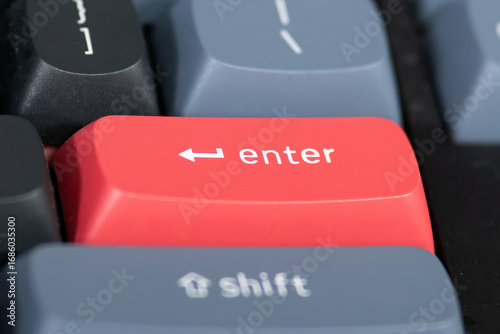 close up from a Red enter keyboard key with focus on the return key