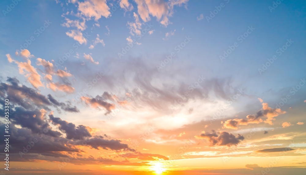 Fototapeta premium A breathtaking sunset view with a vibrant array of colors across a dramatic sky filled with varied clouds.