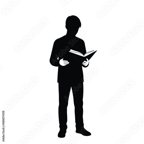 Silhouette of a man standing while reading an open book.