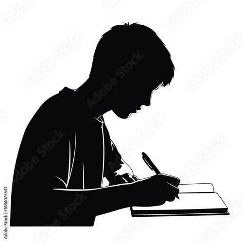 Silhouette of a young boy writing in a notebook.