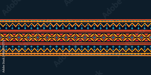 Vibrant tribal geometric pattern with zigzags and diamonds in warm colors on a dark background
