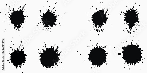 Collection of eight black ink splatter brush strokes and drops on white background