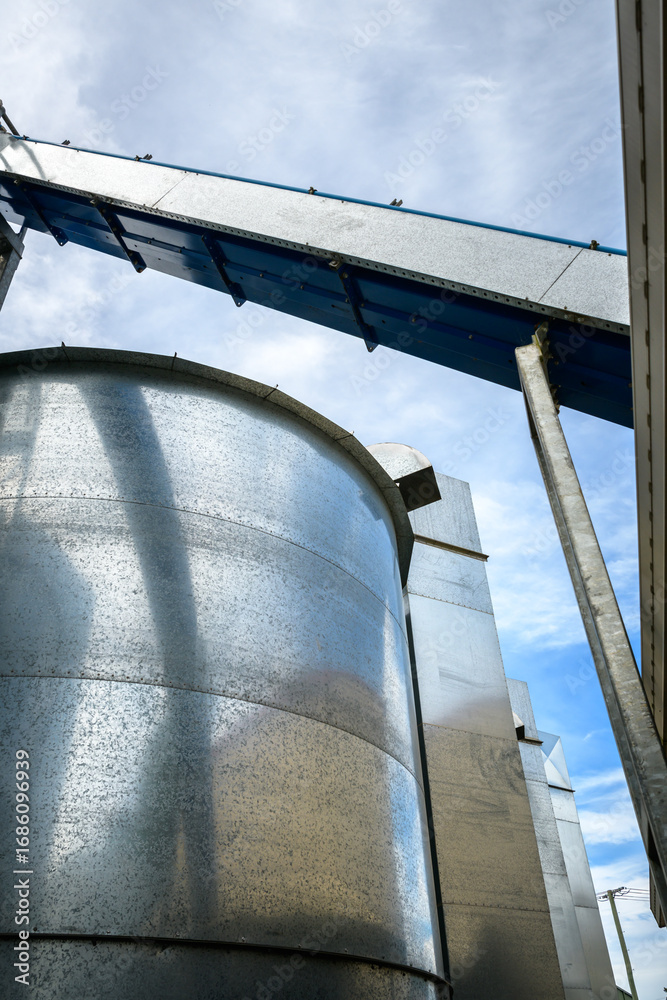 Naklejka premium Metal grain storage silos - vertical