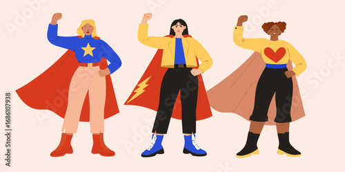 Diverse group of three women dressed as superheroes with capes and fists raised in solidarity and empowerment