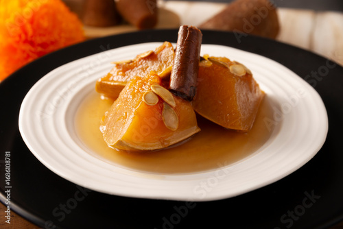 Calabaza en Tacha. Spiced Candied Pumpkin. Mexican dessert whose main ingredients are pumpkin and piloncillo, also known as Chacualole or Dulce de Calabaza, widely used in Day of the Dead offerings.